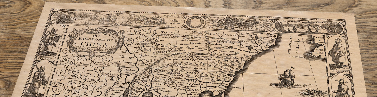 Upper section of China - an old map by John Speed, lying at an angle on an antique ash table