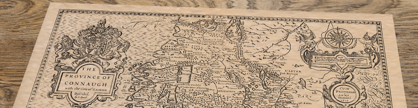 Upper section of Old Map of Connacht, lying at an angle on an antique ash table