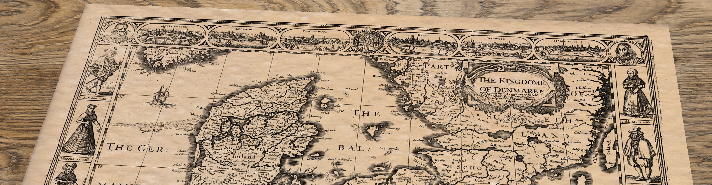 Upper section of Old Map of Denmark c.1600, lying at an angle on an antique ash table