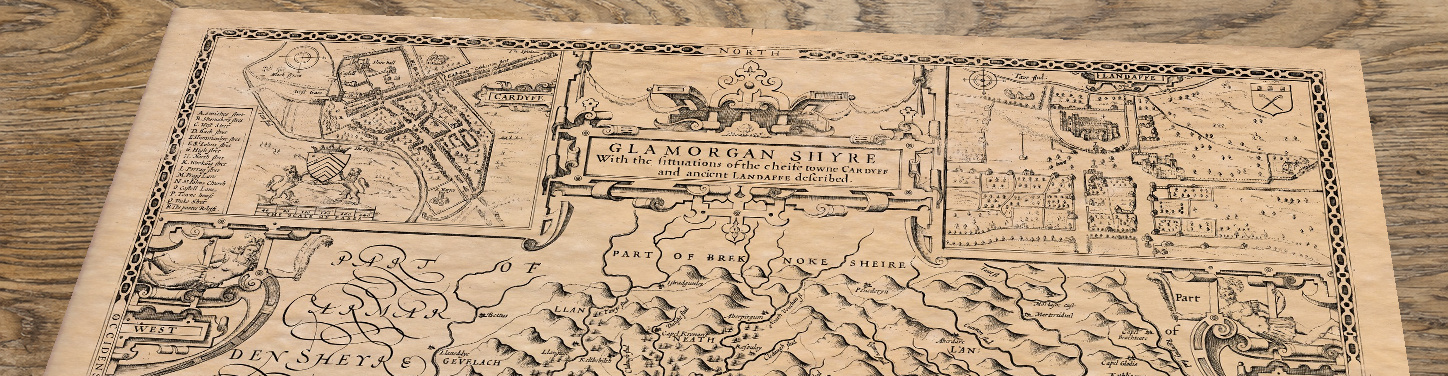 Upper section of Glamorganshire, lying at an angle on an antique ash table