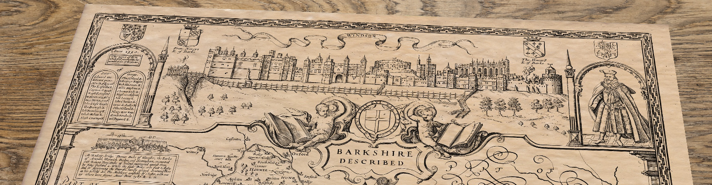 Upper section of Old Map of Berkshire, lying at an angle on an antique ash table