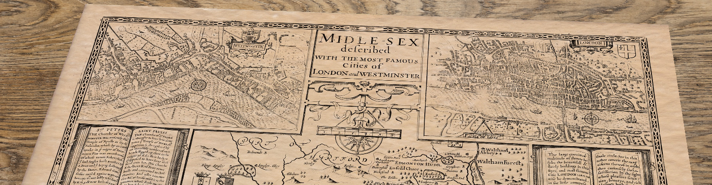 Upper section of Middlesex - an old map by John Speed, lying at an angle on an antique ash table
