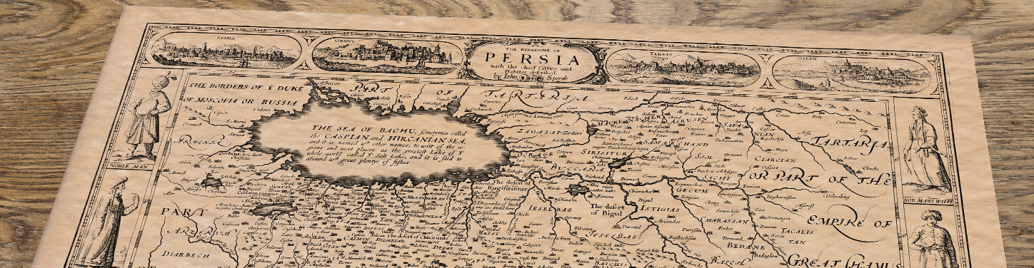 Upper section of Persia - (Iran) an old map by John Speed, lying at an angle on an antique ash table