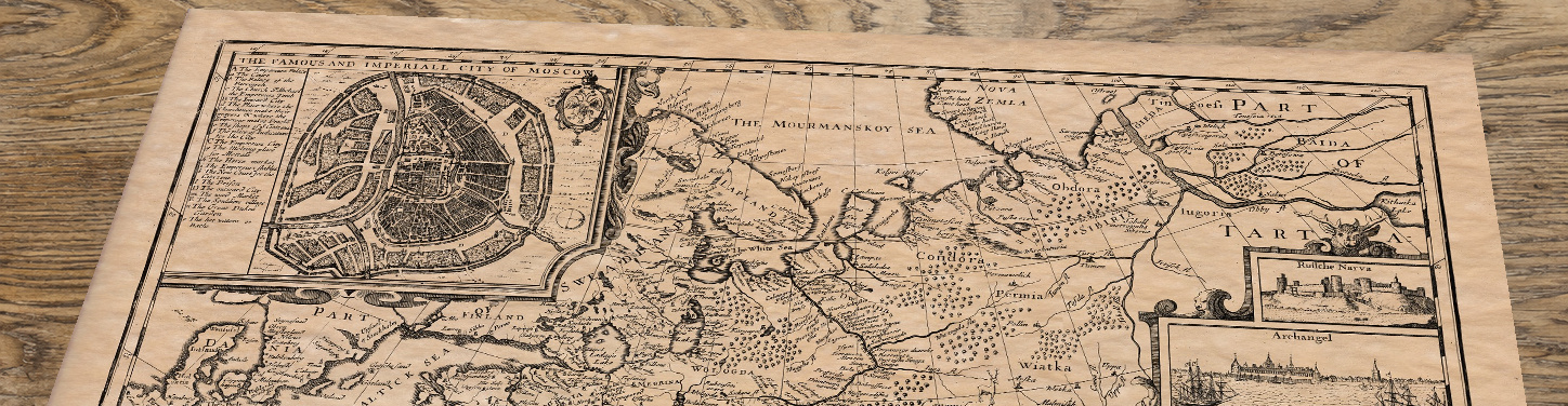 Upper section of Russia - an old map by John Speed, lying at an angle on an antique ash table