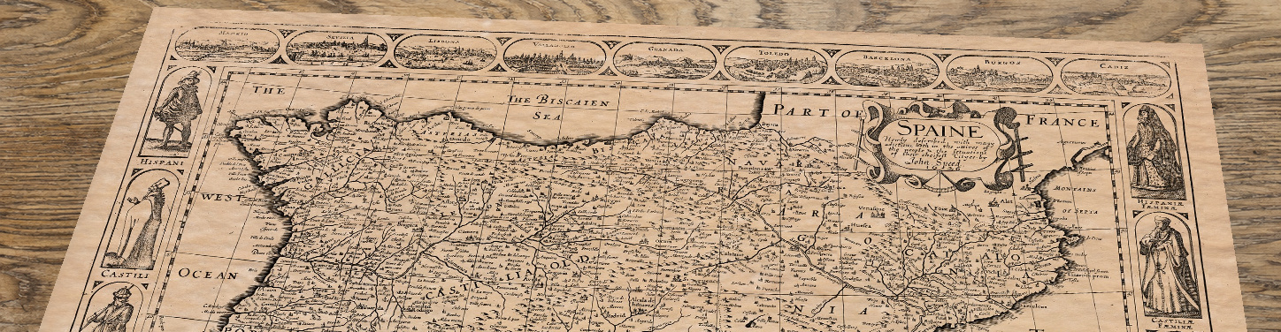 Upper section of Spain - an old map by John Speed, lying at an angle on an antique ash table